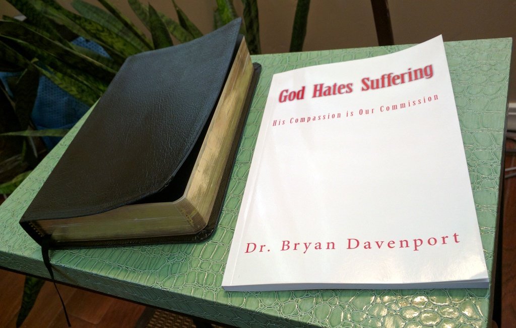 Book by Dr. Bryan Davenport on my coffee table: 'God Hates Suffering'
